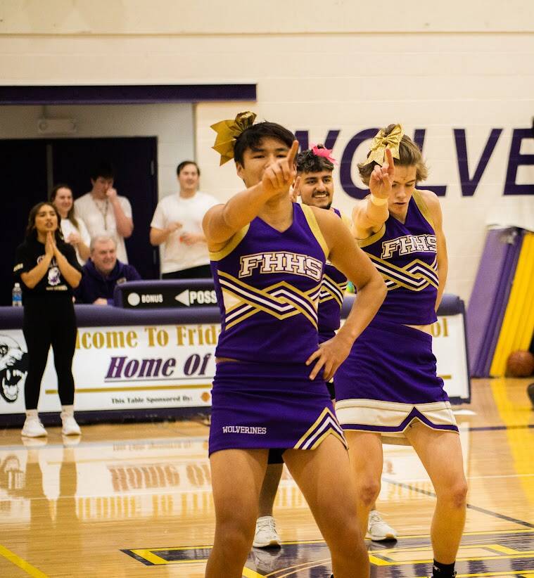 Aiden Haines/Staff photo
Wolverine Cheerleaders Eric Corbin, Jaxson Waldron, and Alex Mora