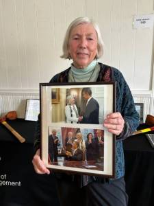 Heather Spaulding \ Staff photo
Asha Lena holding a photo of her with President Obama.