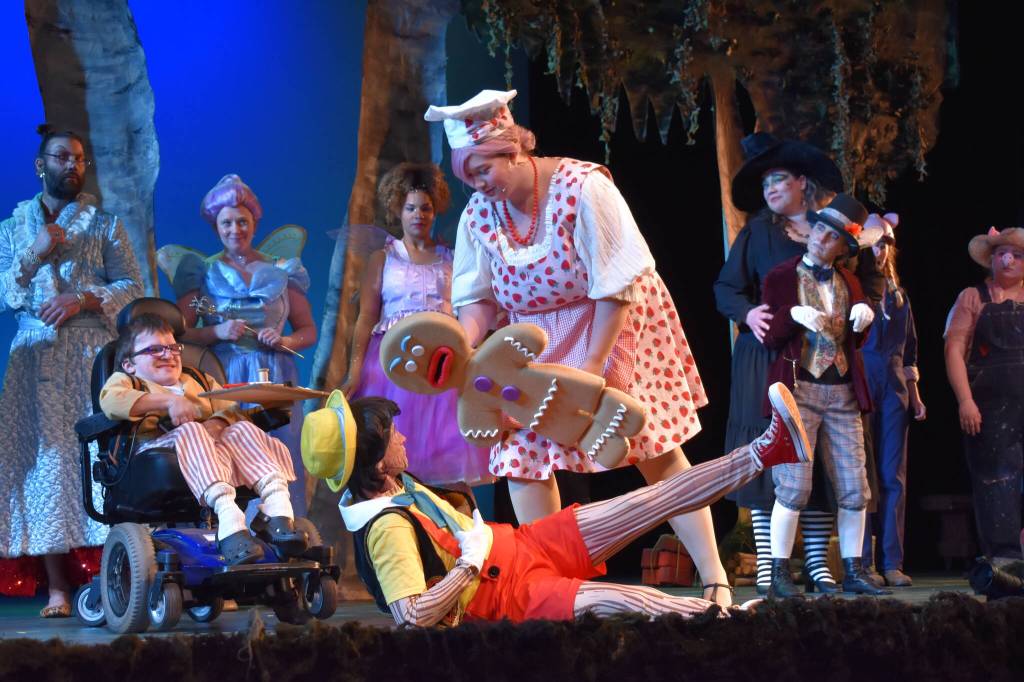 Kelley Balcomb-Bartok / Staff photo
Gingy the Gingerbread Man (Ashlynn Wilson) challenges Pinocchio (Corbin Blue) as a cast of homeless fairy-tale characters (including Clayton Banry, left) look on after theyve been evicted by the vertically challenged Lord Farquaad.