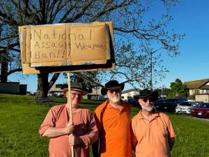 Heather Spaulding \ Staff photo From left to right:
Ken Crawbuck and friends shine a spotlight on gun violence.