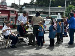 Heather Spaulding \ Staff photo
Young Cub Scouts were given flowers to toss into the harbor.