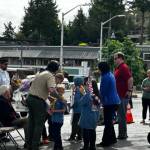 Heather Spaulding \ Staff photo
Cub Scouts get flowers to toss into the harbor.