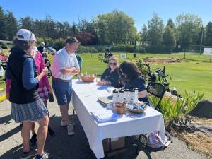 Contributed photo
Heritage Bank volunteers check in players at the Golf Fore! Scholarships.
