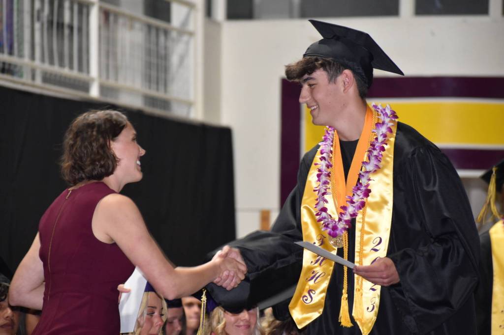 Kelley Balcomb-Bartok / sSaff photo
Co-Valedictorian Zachary Place accepts a scholarship during the 2023 Friday Harbor High School Commencement ceremonies. Place is headed to Southern California to attend UCI, majoring in biochemistry.