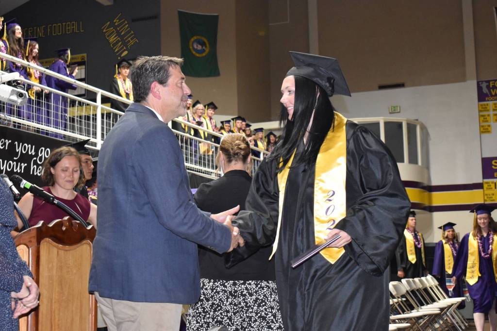 Kelley Balcomb-Bartok / Staff photo
Friday Harbor High School senior Danielle McKay is congratulated by Superintendent Fred Woods as she receives her high school diploma. McKay is headed to Central Washington University to study exercise science.