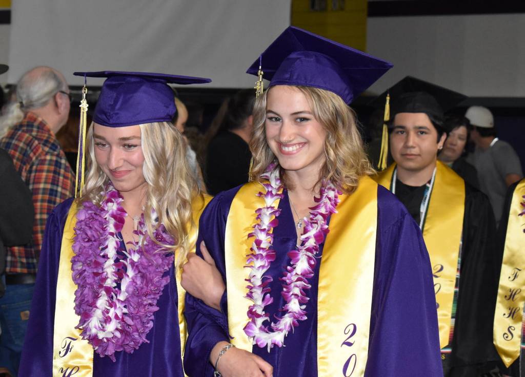 Kelley Balcomb-Bartok / staff photo
Friday Harbor High school seniors Lily Rock and Fela Andrews enter the Turnbull Gym in procession as they prepare to take their seats for graduation.