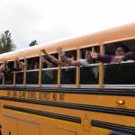 Kelley Balcomb-Bartok / Staff photo
Friday Harbor graduates wave from the school bus as they parade through the streets of Friday Harbor.