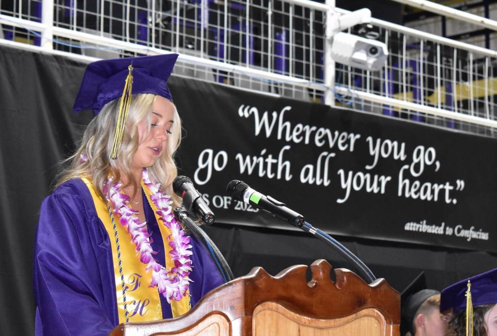 Kelley Balcomb-Bartok / Staff photo
ASB President Aryana Berube welcomes the audience and shares some history about her fellow graduating seniors. Berube says she plans to get a Masters Degree then volunteer teaching english and traveling. She says her dream career would be working in foreign affairs with an environmental standpoint.