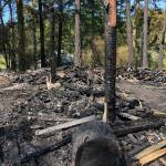 Kelley Balcomb-Bartok \ Staff photo
Charred remains of the woodshed.