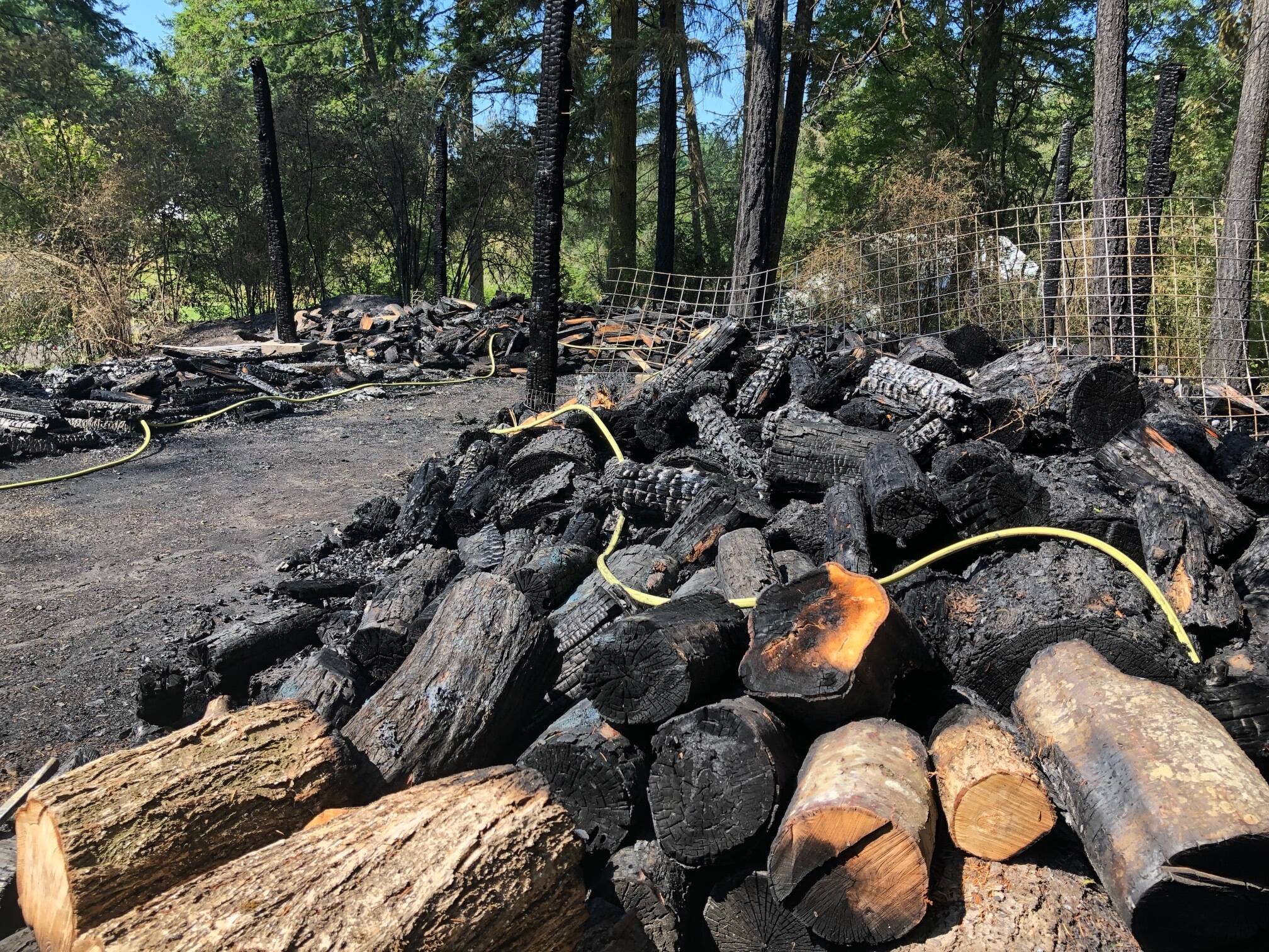 Kelley Balcomb-Bartok Staff photo
Charred woodpile.