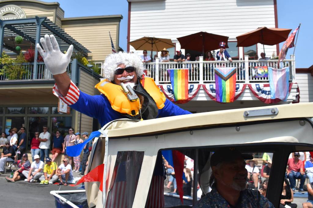 Kelley Balcomb-Bartok staff photo
A member of the San Juan Island Yacht Club waves to the crowd during the 2023 Friday Harbor Fourth of July parade.