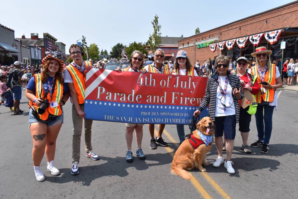 Kelley Balcomb-Bartok staff photo
Staff and volunteers of the San Juan Island Chamber of Commerce celebrate another successful parade at the tail end of their annual Friday Harbor Fourth of July parade.