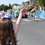 Kelley Balcomb-Bartok staff photo
A young parade-goer waves to the Young Adult Association of San Juan Island (Y.A.A.S.) as they approach down Spring Street into downtown Friday Harbor.