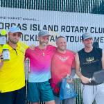 Group A Mens Doubles finishers: Michael Harlow and Valerie Alexandov (second place), and Nigel Oswald and Jemuel Morris (first place).