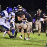 Kelley Balcomb-Bartok \ Staff photo
Quarterback weaves through opponents.