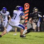 Kelley Balcomb-Bartok \ Staff photo
Quarterback runs it in.