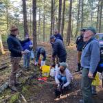 Photo by Isabel Ashley
Doug McCutchen (left) gives an introduction to acorn-planting volunteers before they begin.