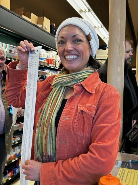 Heather Spaulding Staff photo
Rachelle Radonski holding the long receipt.