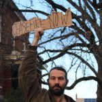 Heather Spaulding Staff photos
Heather Spaulding / Staff photo
An attendee Nov. 15 holds up a sign for cease-fire