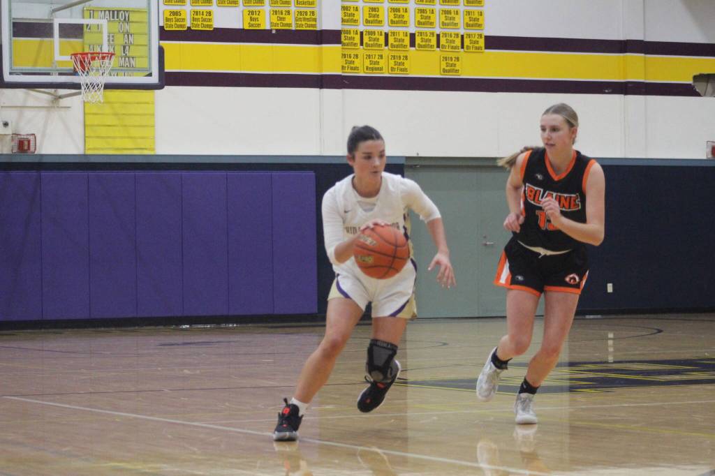Isabel Ashley/Staff photo
Mia Germain, Junior, takes the ball down the court.