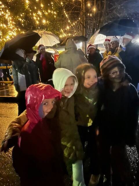 Heather Spaulding/Staff photo
Children enjoying the adventure of raining caroling
