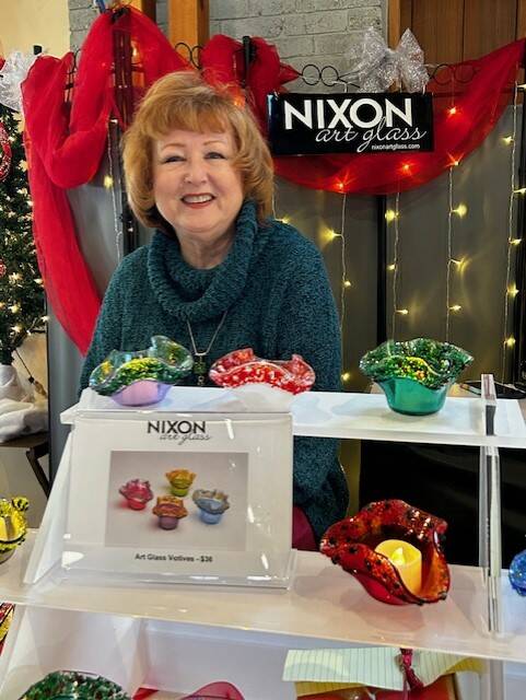Heather Spaulding  Staff photo
Darlene Nixon shows off her glass work at the Holdiay Market