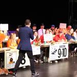 Staff photo/ Isabel Ashley
MC Mason Turnage strides across the stage to check the teams answers