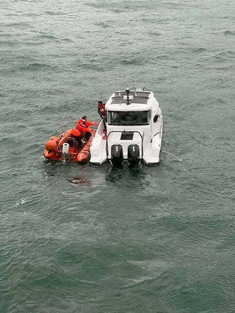 Contributed photo by Patrick Cabe
Ferry crew approach the vessel in distress.