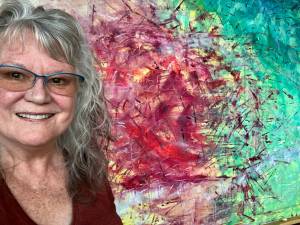 Contributed photo
Amanda Azous infront of one of her paintings