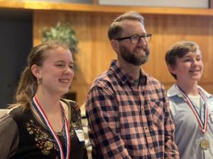 Contributed photo by Barbara Marrett 
Hazel Johnson, first place winner; teacher, Michael McKinnon; Elliot Roach, second place winner.