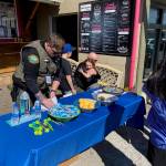 Isabel Ashley \ Staff photo
Sheriff Eric Peter greets one of the children participating in the Easter Walk.
Isabel Ashley \ Staff photo Sheriff
Eric Peter greets one of the children participating in the Easter Walk.