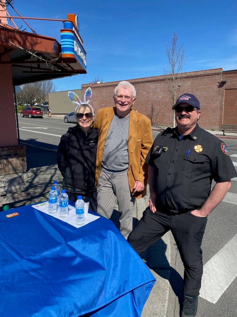 Isabel Ashley \ Staff photo
Fire Chief Noel Monin (right) and Fire Commissioner Warren Appleton (middle) are stationed at the corner of Spring and 2nd street, waiting to give stamps to those participating in the Easter Walk.
Isabel Ashley \ Staff photo
Fire Chief Noel Monin (right) and Fire Commissioner Warren Appleton (middle) are stationed at the corner of Spring and 2nd Street, waiting to give stamps to those participating in the Easter Walk.