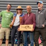 Phil Green pictured with his Lifetime Achievement Award for his dedication to stewardship on the islands. He is joined by (from left to right) Tyler Davis, Francis Roberston and Doug McCutchen, who spoke on Greens exemplary efforts to protecting the environment for the last few decades.
Staff photo / Isabel Ashley