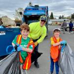 Contributed photo
Volunteers return their trash bags to the collection site