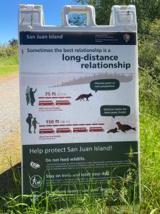 Staff photo / Isabel Ashley
Example of signage educating the public on appropriate distances between humans and wildlife, located on San Juan Island National Historical Park.