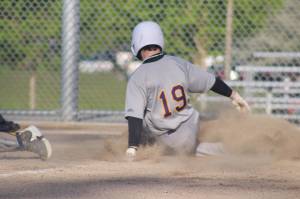 Heather Spaulding Staff photo
Freshman Joseph Holt comes slides into homeplate.
