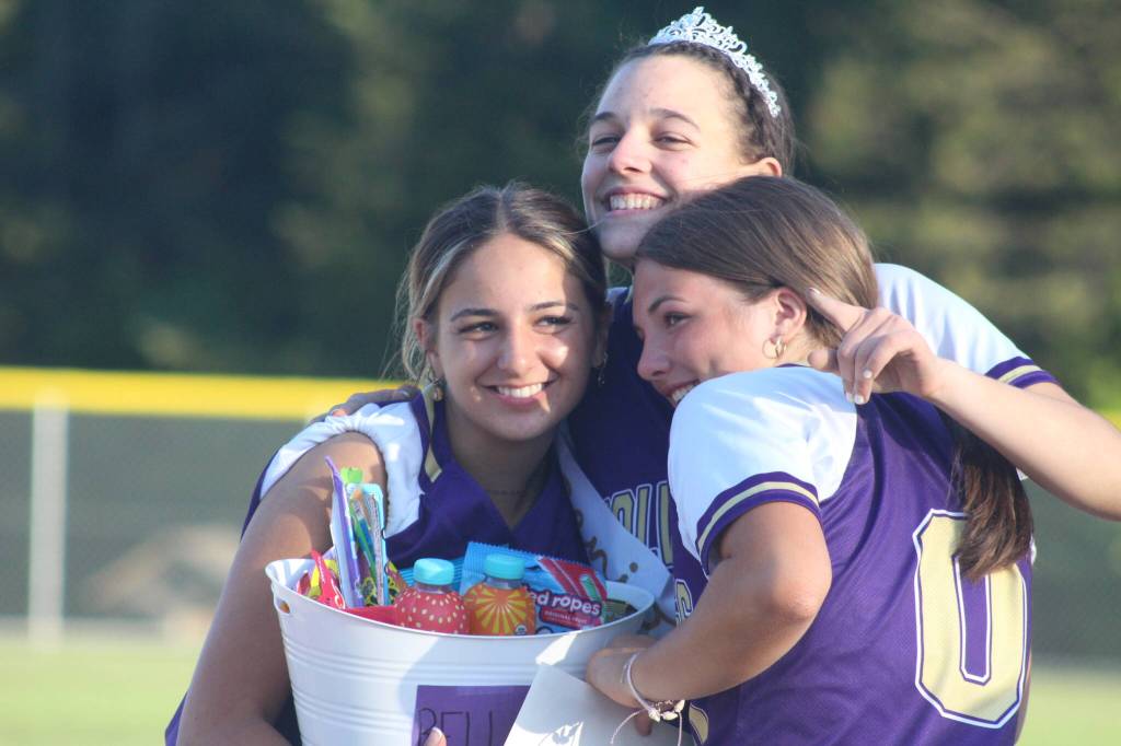 Heather Spaulding Staff photo
Senior Bella Ross hugs her teammates.