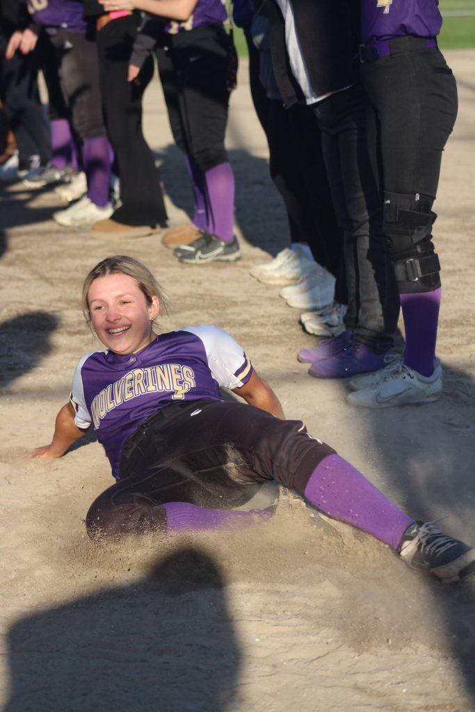 Heather Spaulding Staff photo
Senior Nakayla Nibler slides into home plate for the last time.