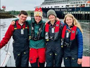Submitted photo
The Juvenile Delinquents team pose for a picture in their gear. From Left to right: Bryce Lutz (Bellingham), Willow Gray (Bellingham), Dagny Kruger (Orcas) and Else Ranker (Orcas)