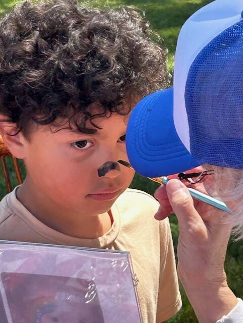 Heather Spaulding \ Staff photo
One attendee stays very still for face painting.