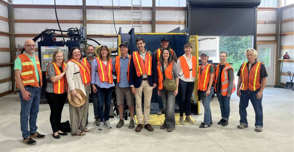 Colleen Smith Summers photo.
Left to right: Greg Sawyer of San Juan County; Jessica Hudson SJC; Cindy Wolf SJC Council; Carey Eskridge, Orcas Chamber; Kendra Smith, SJC; Pete Moe, Exchange; State Rep. Alex Ramel; Troy Lautenbach, Lautenbach Recycling; Katie Fleming, SJC; Krista Bouchey, OPALCO; Carolyn Moulton, Lautenbach Recycling; Angela Broderick, SJC; Jon Gratch, Exchange Board.