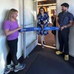 Heather Spaulding \ Staff phot
o Anna Maria de freitas, Chamber Board member and Roberto Moya, Chamber President, hold the ribbon as April Randall cuts it.