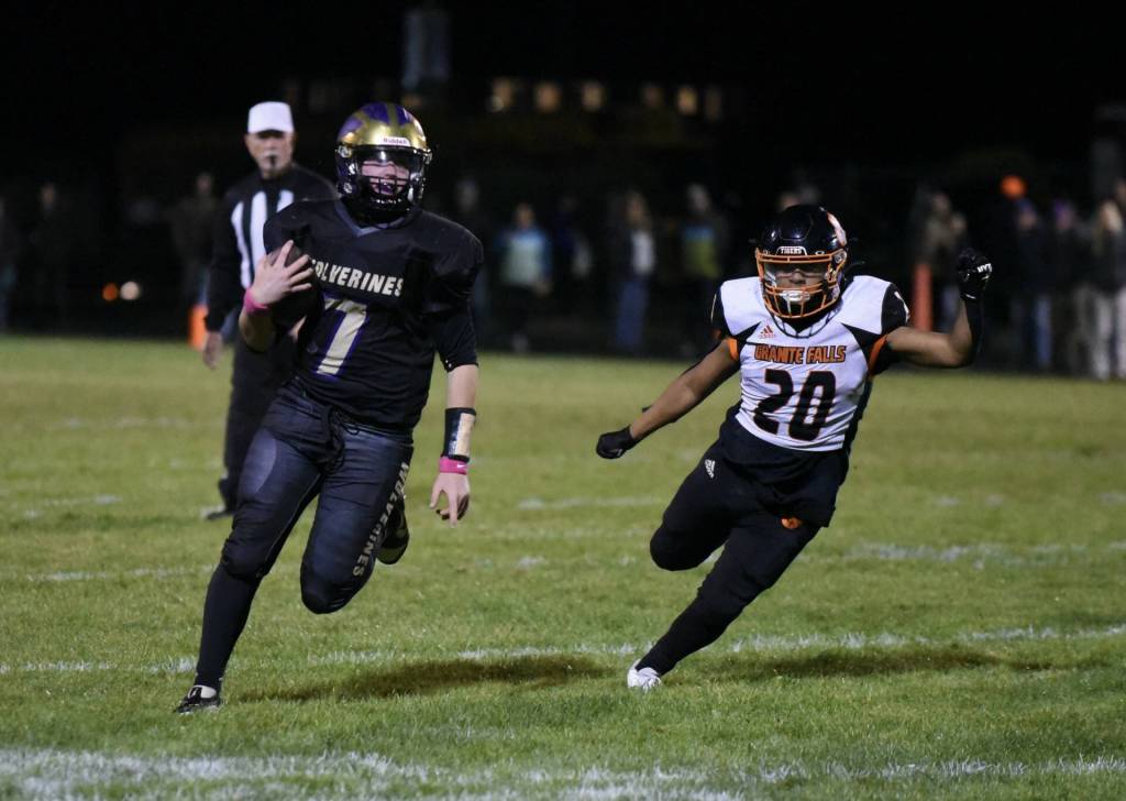 Cotributed photo by John Stimpson
Wolverine Quarterback #7 Jackson Felix runs for good yardage.