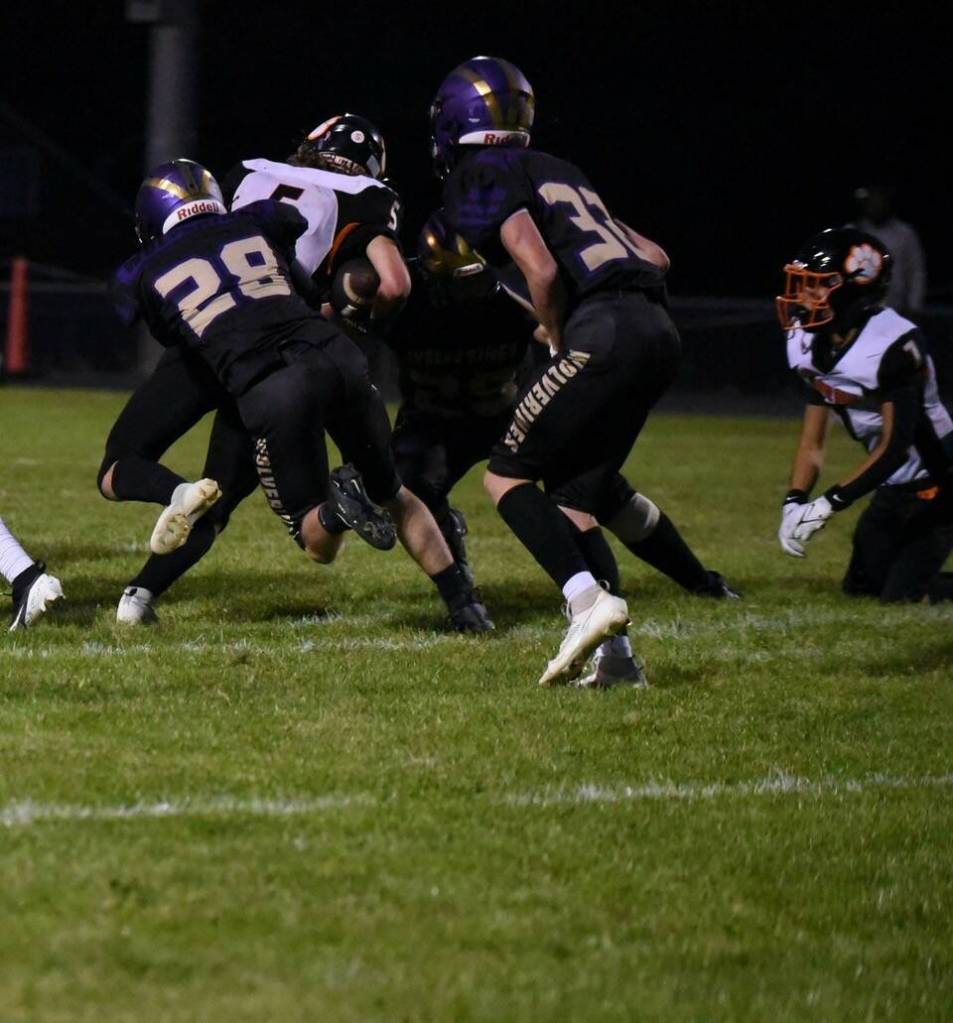 Contributed photo by John Stimpson
Wolverine #28, Marcos Soto, tackles Tiger running back.