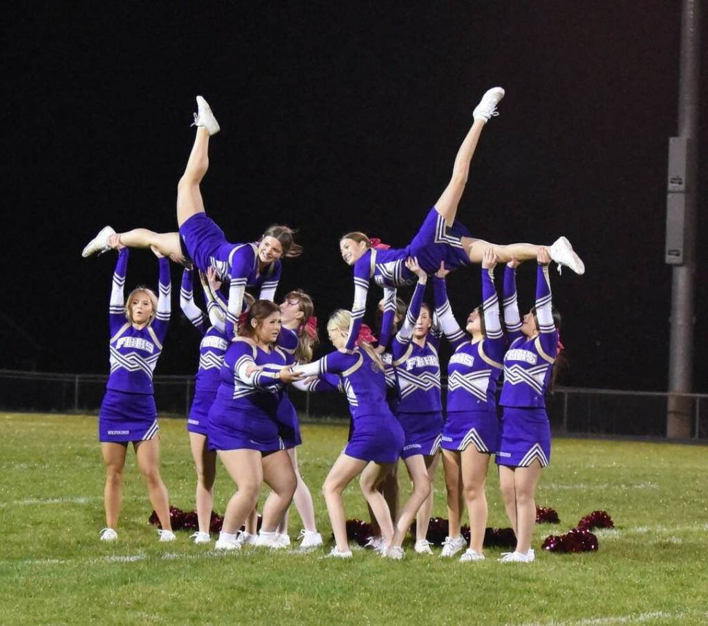 Contributed photo by John Simpson
Despite the rain downpour the Wolverine cheer leaders put on a spirited performance!