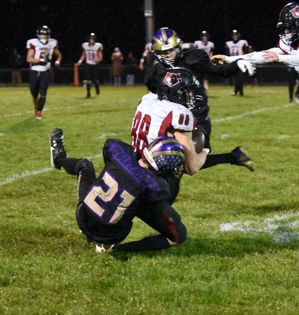 Contributed photo by John Simpson
Wolverine #21 Jaden Harrison stops Wolves running back.