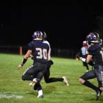 Contributed photo by John Simpson
Wolverine #30
Pierce Kleine provides blocking for his brother #12 Channing Kleine for a good yardage gain.