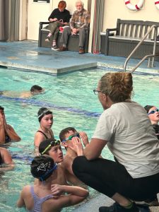 Anna Vaught photo.
Swimmers get last-minute instructions from Coach Susan.
