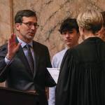 Gov. Bob Ferguson is sworn into the office Jan 15. in Olympia. With him were his twins, Jack and Katie, and his wife, Colleen Ferguson. Photo by Juan Jocom.