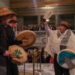 The Squaxin Island tribe performs ceremonial songs in the middle of the Legislative Building, while guests watched by the stairs right before Gov. Bob Fergusons speech.